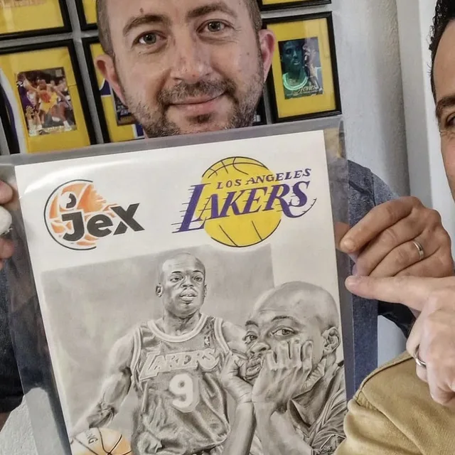 JEX holding the finished graphite drawing of Nick Van Exel.
